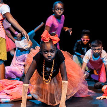 Students performing on a stage