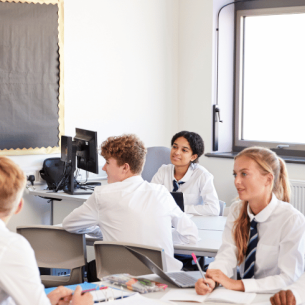 Teacher teaching teenagers, representing curriculum and assessment review