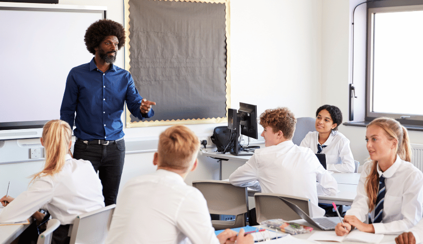 Teacher teaching teenagers, representing curriculum and assessment review