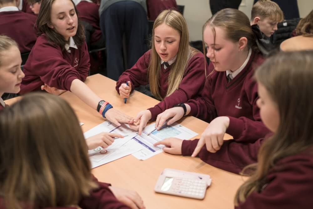 A group of secondary school girls in a classroom