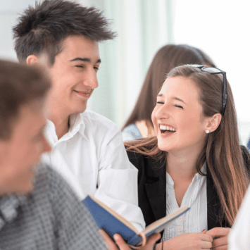 Teenager students playing Spanish games in class