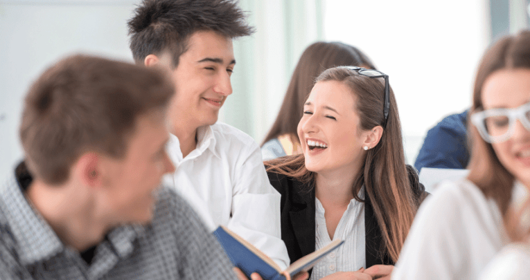 Teenager students playing Spanish games in class