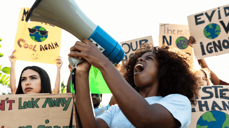 Student taking part in climate protest, representing teaching citizenship