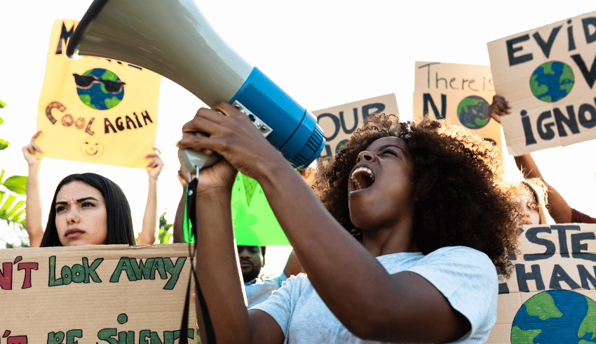 Student taking part in climate protest, representing teaching citizenship