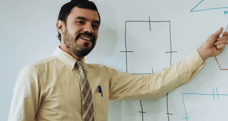 Teacher at whiteboard, representing zone of proximal development example