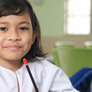 Young girl in classroom, representing school readiness