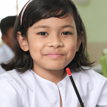 Young girl in classroom, representing school readiness