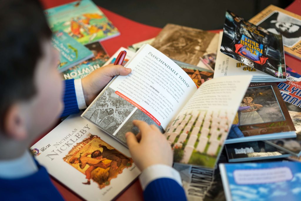 Child reading a Collins Big Cat books