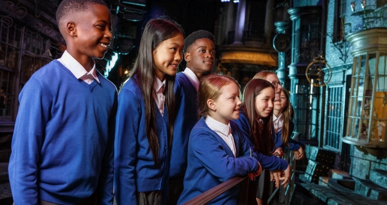 A group of students visiting Warner Bros. Studio Tour London - The Making of Harry Potter