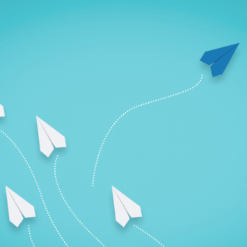 Blue paper aeroplane going a different direction to white ones, representing different teaching styles