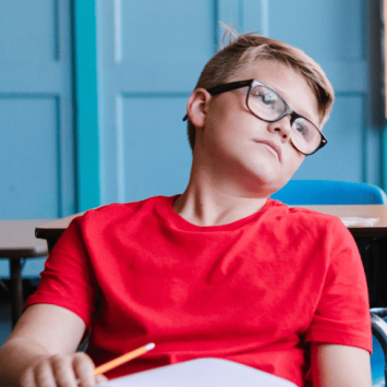 Bored boy at school, representing Year 7 school engagement decline