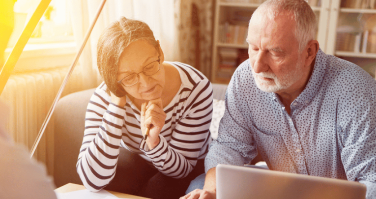 Two people looking at teacher pensions paperwork