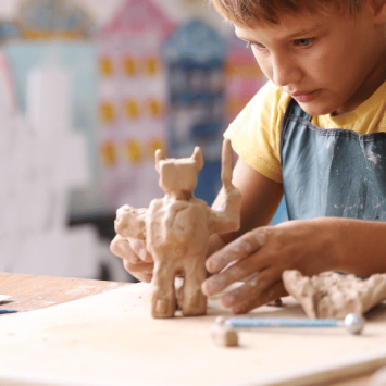 Schoolboy engaging in creative arts