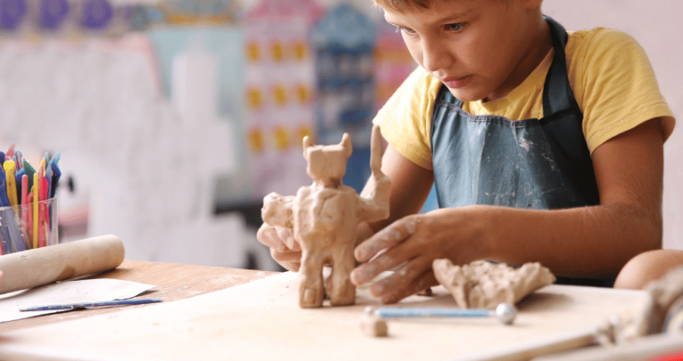 Schoolboy engaging in creative arts