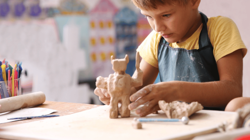 Schoolboy engaging in creative arts