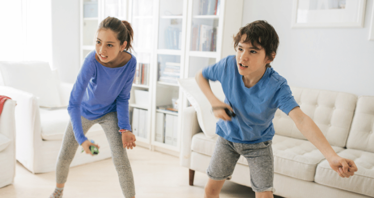 Children doing game-based learning with a dancing game