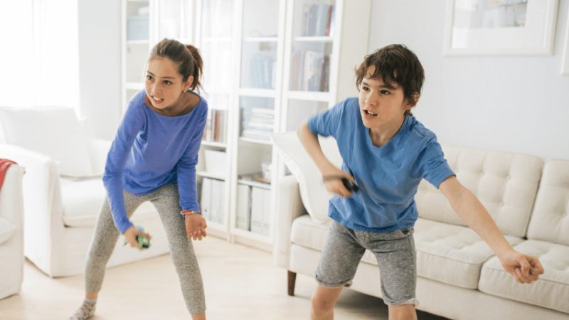 Children doing game-based learning with a dancing game