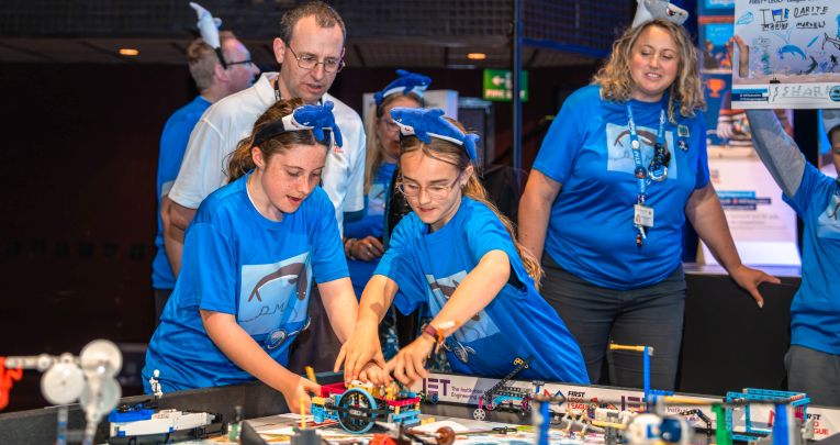 Secondary school pupils and teachers at a First LEGO League challenge event