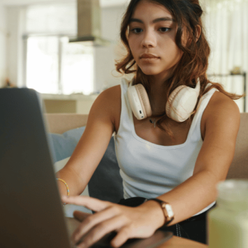 Teenager using revision tools on laptop