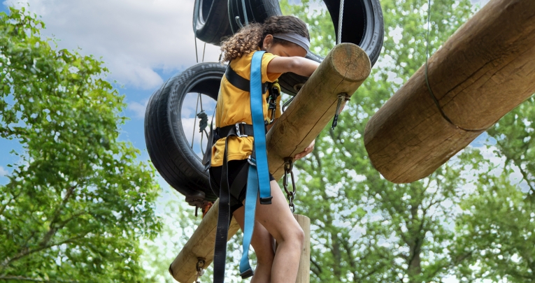A girl on a high ropes course