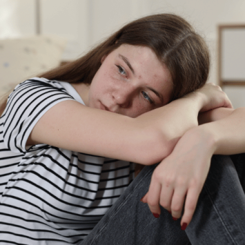 Stressed teenage girl, representing autistic burnout