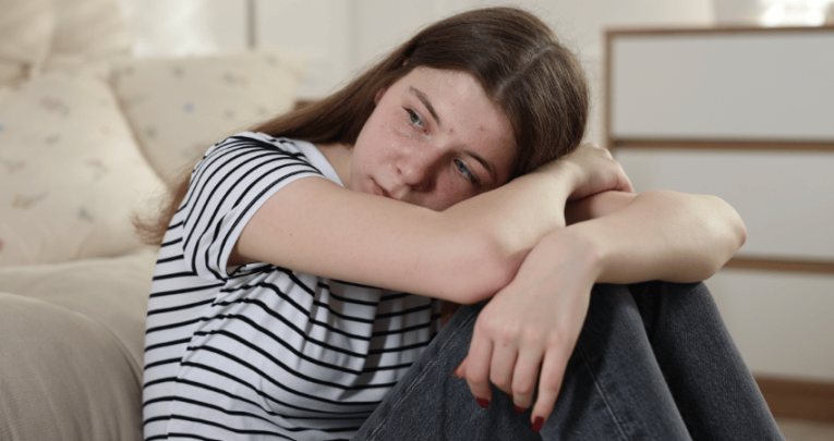 Stressed teenage girl, representing autistic burnout