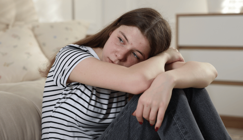 Stressed teenage girl, representing autistic burnout