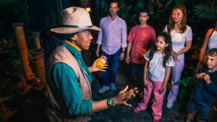 A group children with a guide at The Paddington Bear Experience