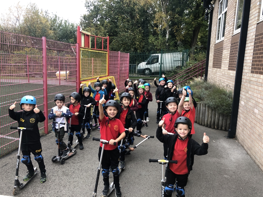 A group of primary schoolchildren on scooters