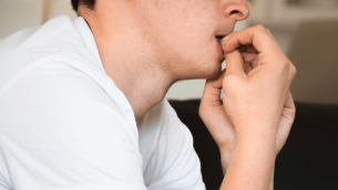 Nervous student biting fingernails, representing access arrangements