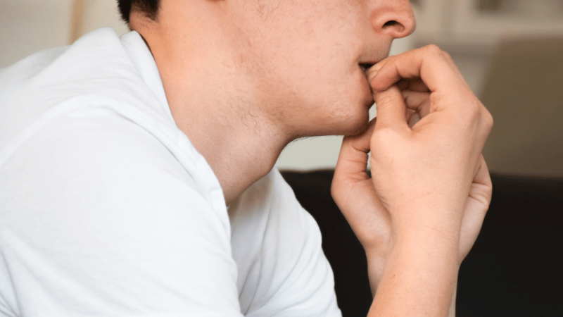 Nervous student biting fingernails, representing access arrangements