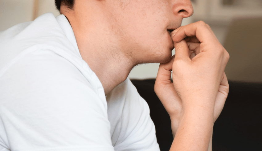 Nervous student biting fingernails, representing access arrangements