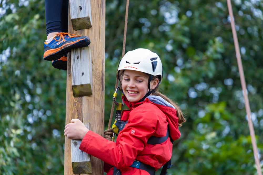 A student climbing at Skern Lodge