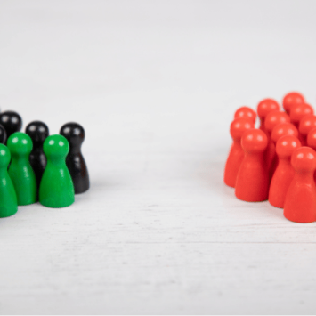 Two opposing groups of wooden counters, representing Citizenship