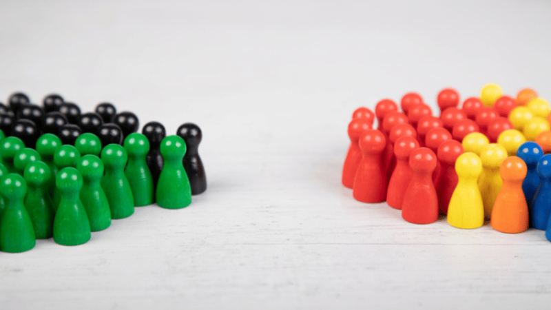 Two opposing groups of wooden counters, representing Citizenship