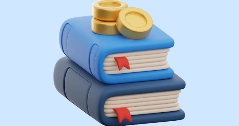 Coins on top of book, representing financial education in schools