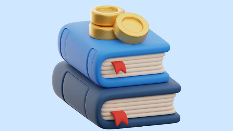 Coins on top of book, representing financial education in schools