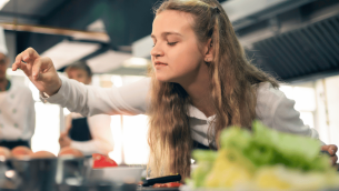 Girl taking part in food technology lesson