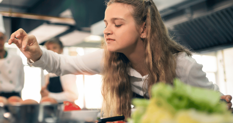 Girl taking part in food technology lesson