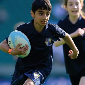 A school boy playing T1 rugby