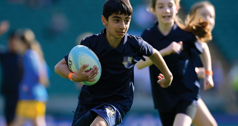 A school boy playing T1 rugby