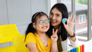 Girl with Down Syndrome at school