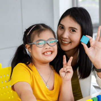 Girl with Down Syndrome at school