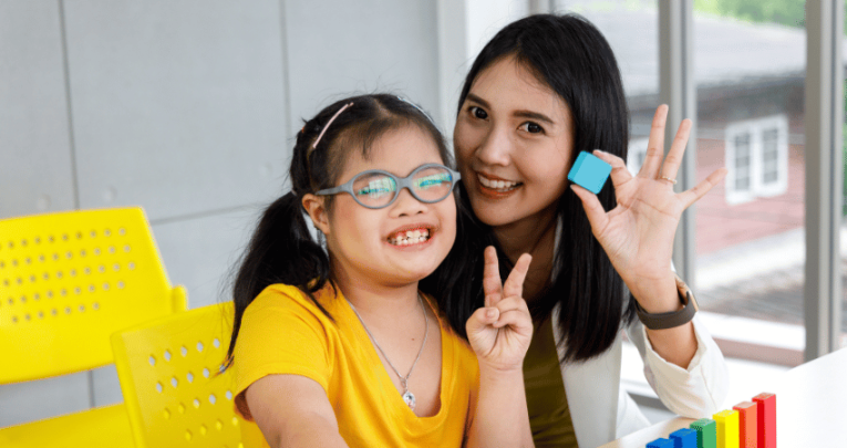 Girl with Down Syndrome at school