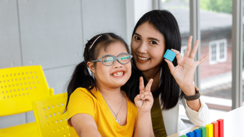 Girl with Down Syndrome at school